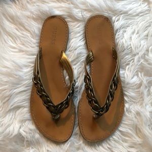 Guess bronze leather flip flops